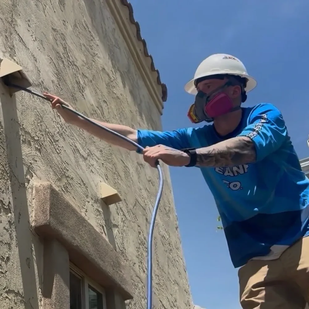 Working an exterior dryer vent from a ladder
